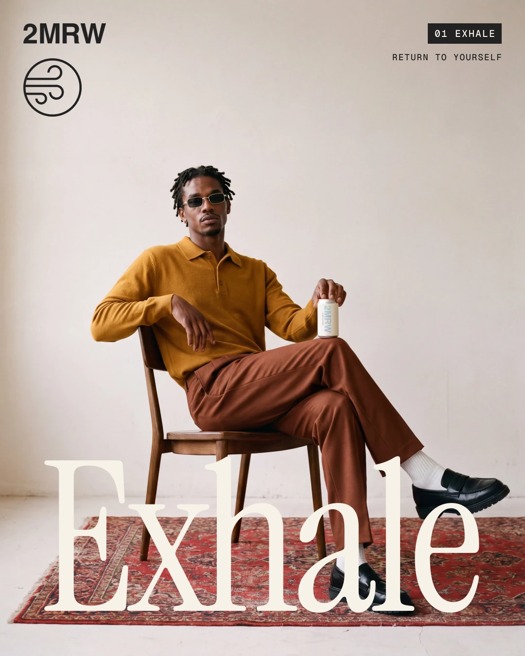 Poster: a man in an ochre polo on a wooden chair holding a 2MRW can, with the word Exhale set large
