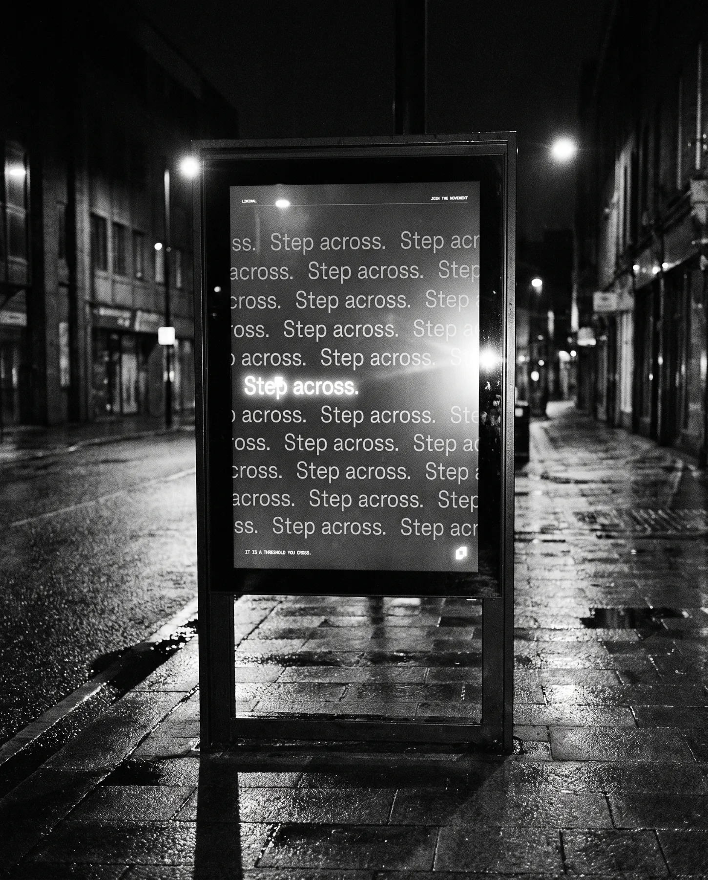A street totem at night showing the Step across poster