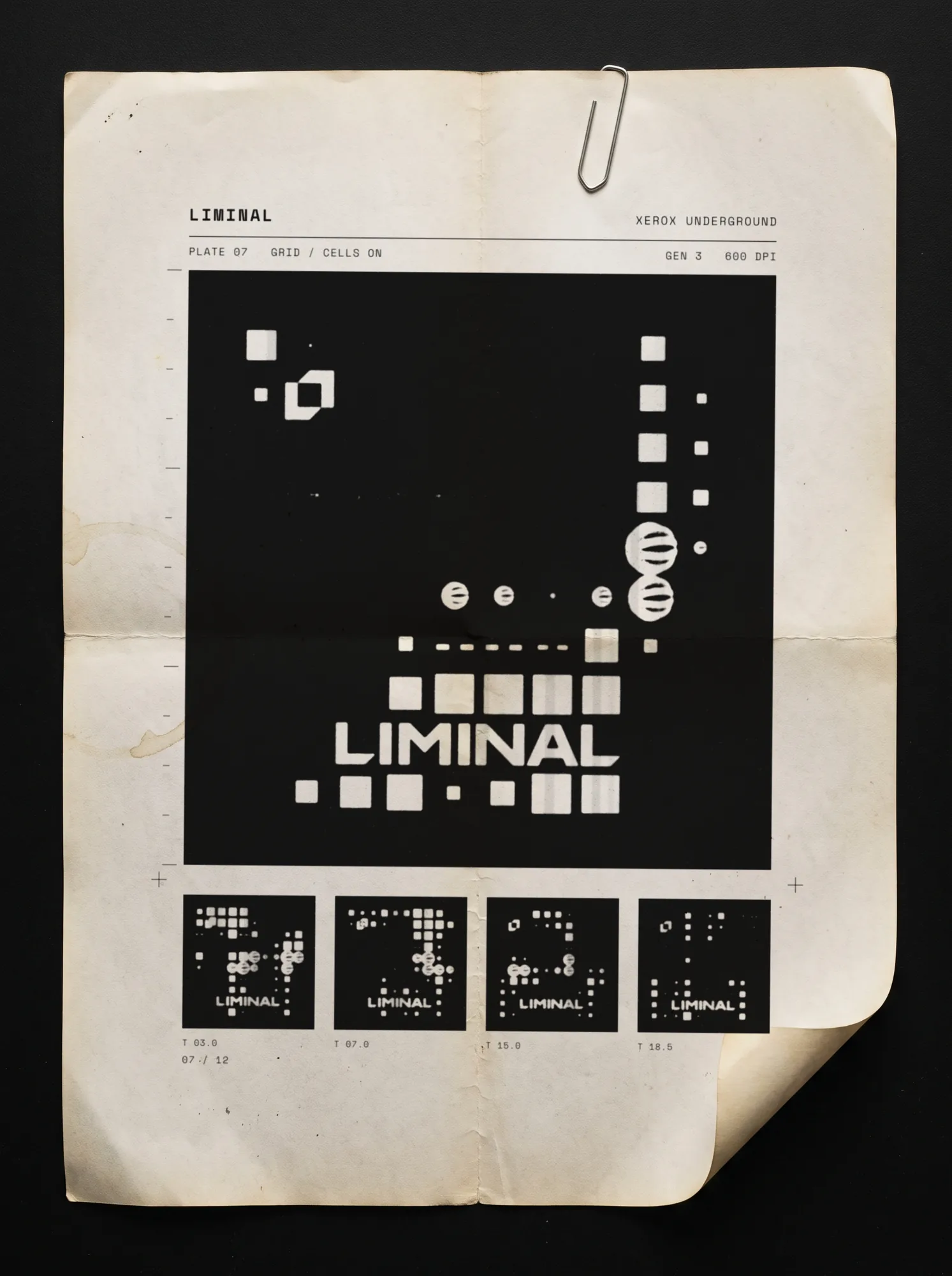A folded, yellowed sheet with a paperclip: plate 07, the grid post photocopied large with four smaller frames under it