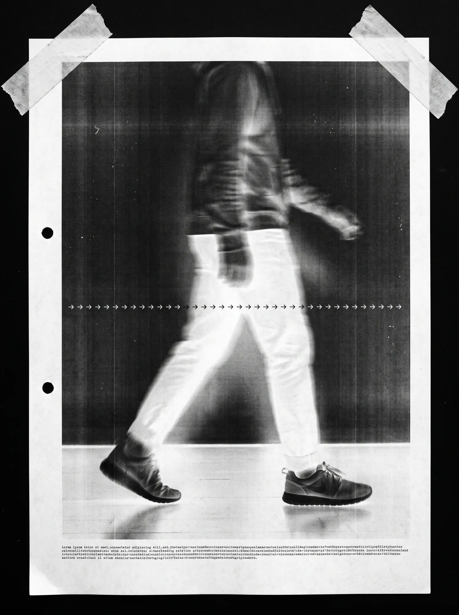 A punched sheet taped at the corners: a negative photocopy of a figure walking, blurred in streaks, with a row of tick marks across it