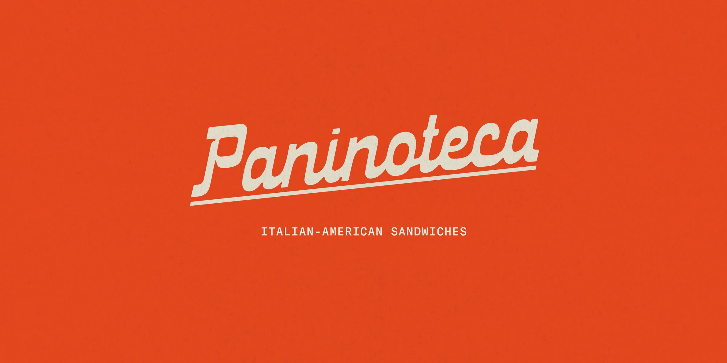 The Paninoteca wordmark painted across the shop window in Dorćol, Belgrade.