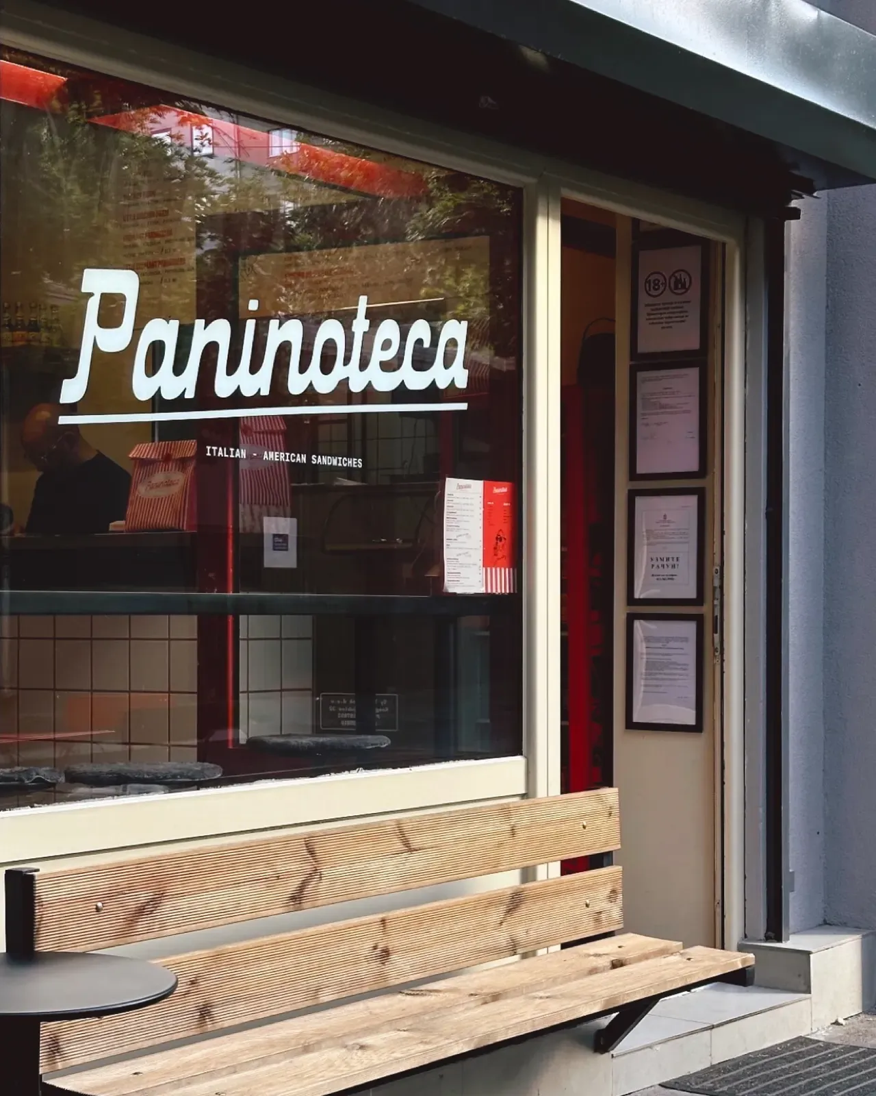 The Paninoteca wordmark painted across the shop window in Dorćol, Belgrade.