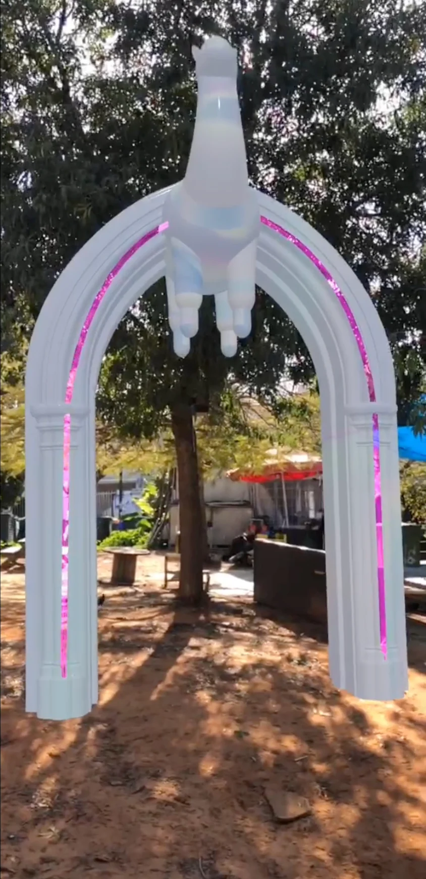 Augmented reality: a white Playhouse arch with neon edges placed in a park