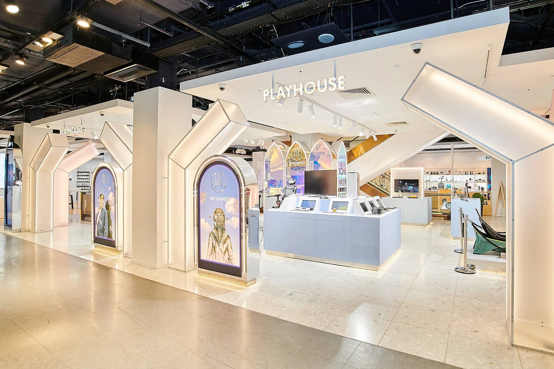 The Playhouse store at Selfridges: white arched portals with the Playhouse name over the entrance and arch-shaped screens along the front