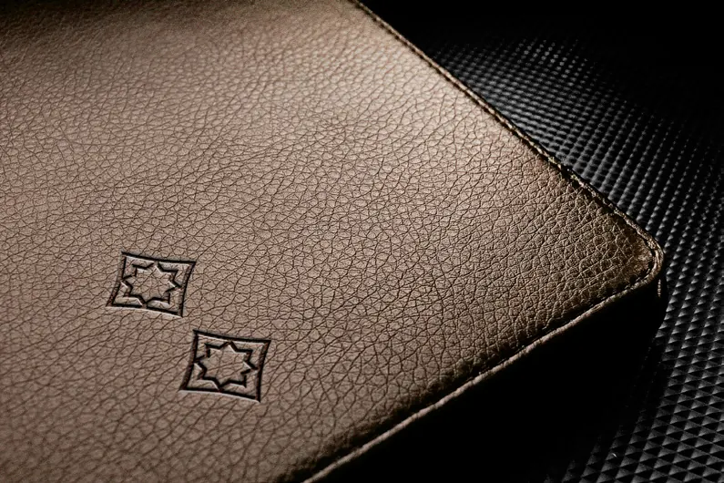 A leather cover debossed with the Shabour marks