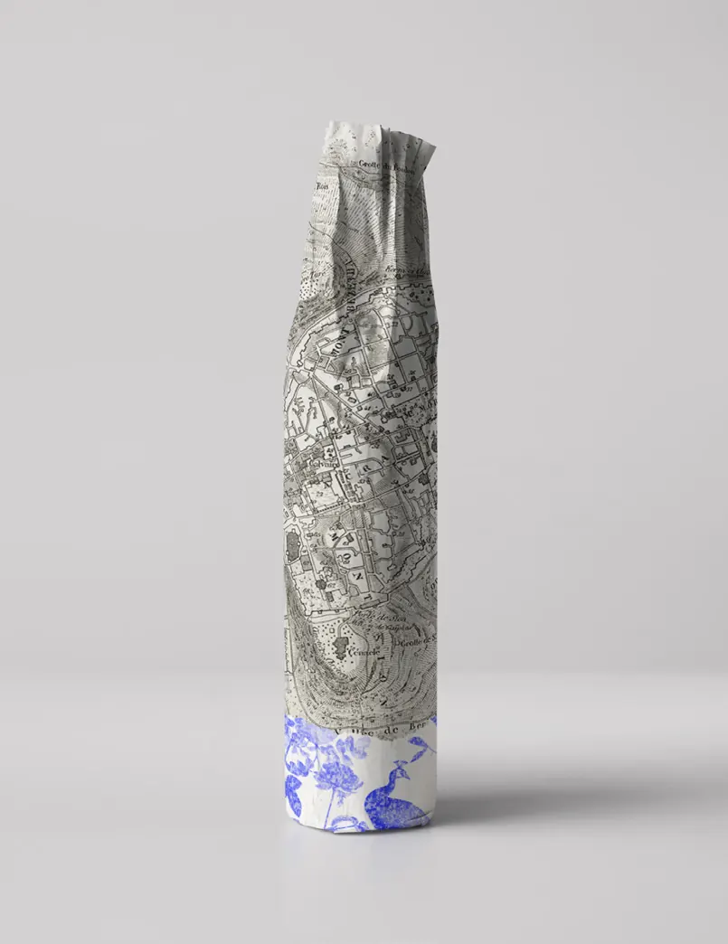 A bottle wrapped in engraved grey paper